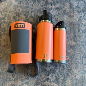 Yeti water bottles with rambler sling in coral color
